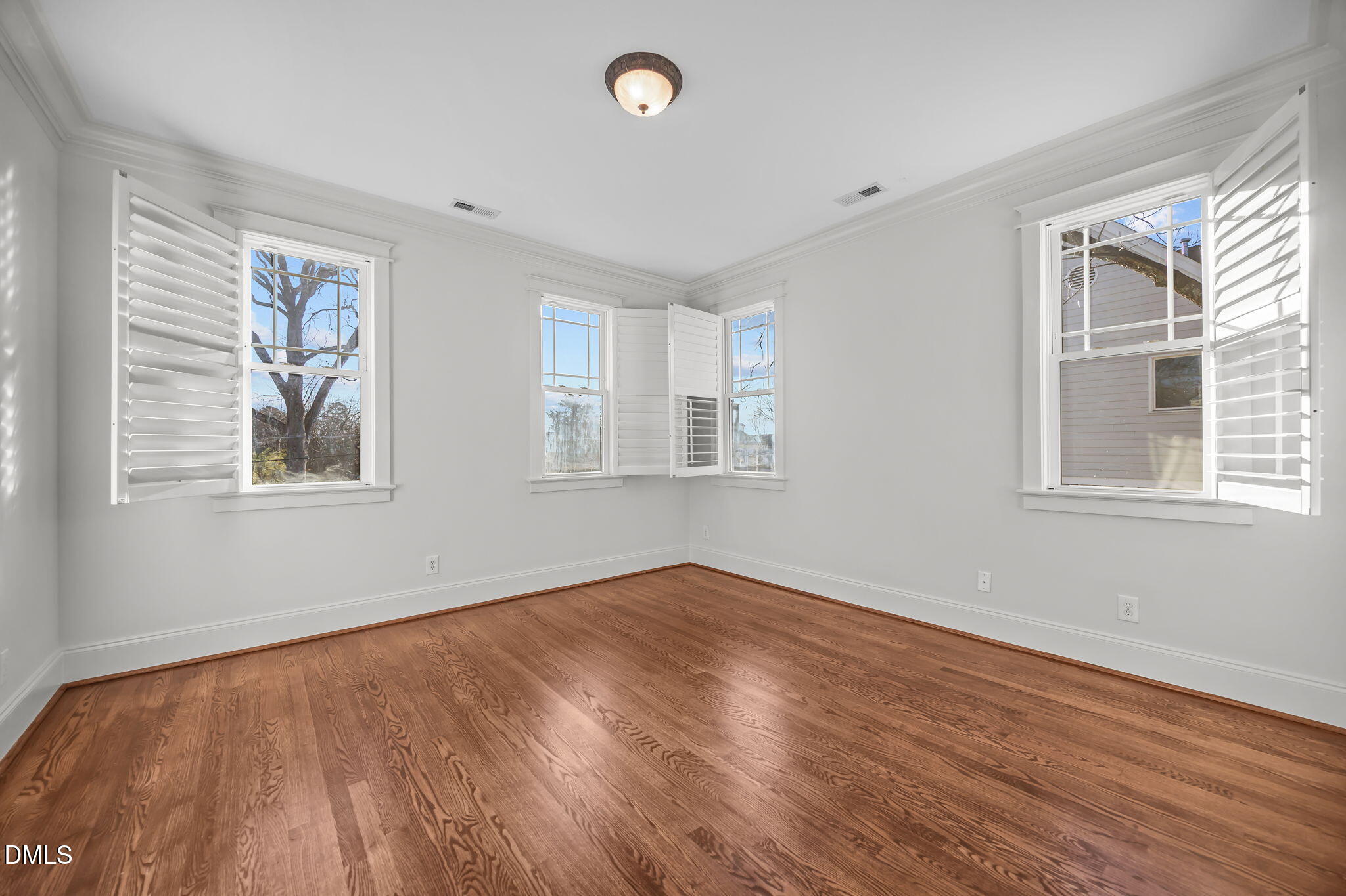 1705 Carson Street Raleigh, NC 27608 - Photo 28 of 47 a view of empty room with wooden floor and fan