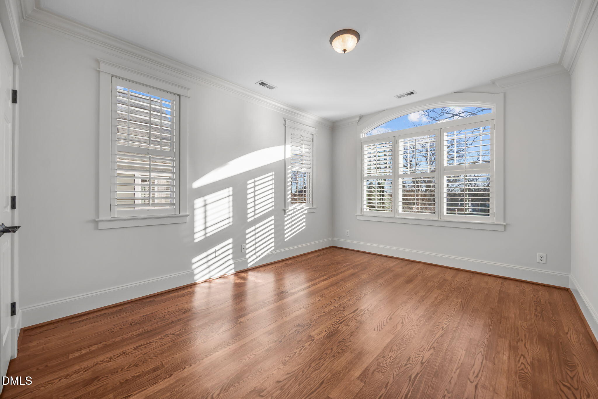 1705 Carson Street Raleigh, NC 27608 - Photo 29 of 47 a view of an empty room with wooden floor and a window