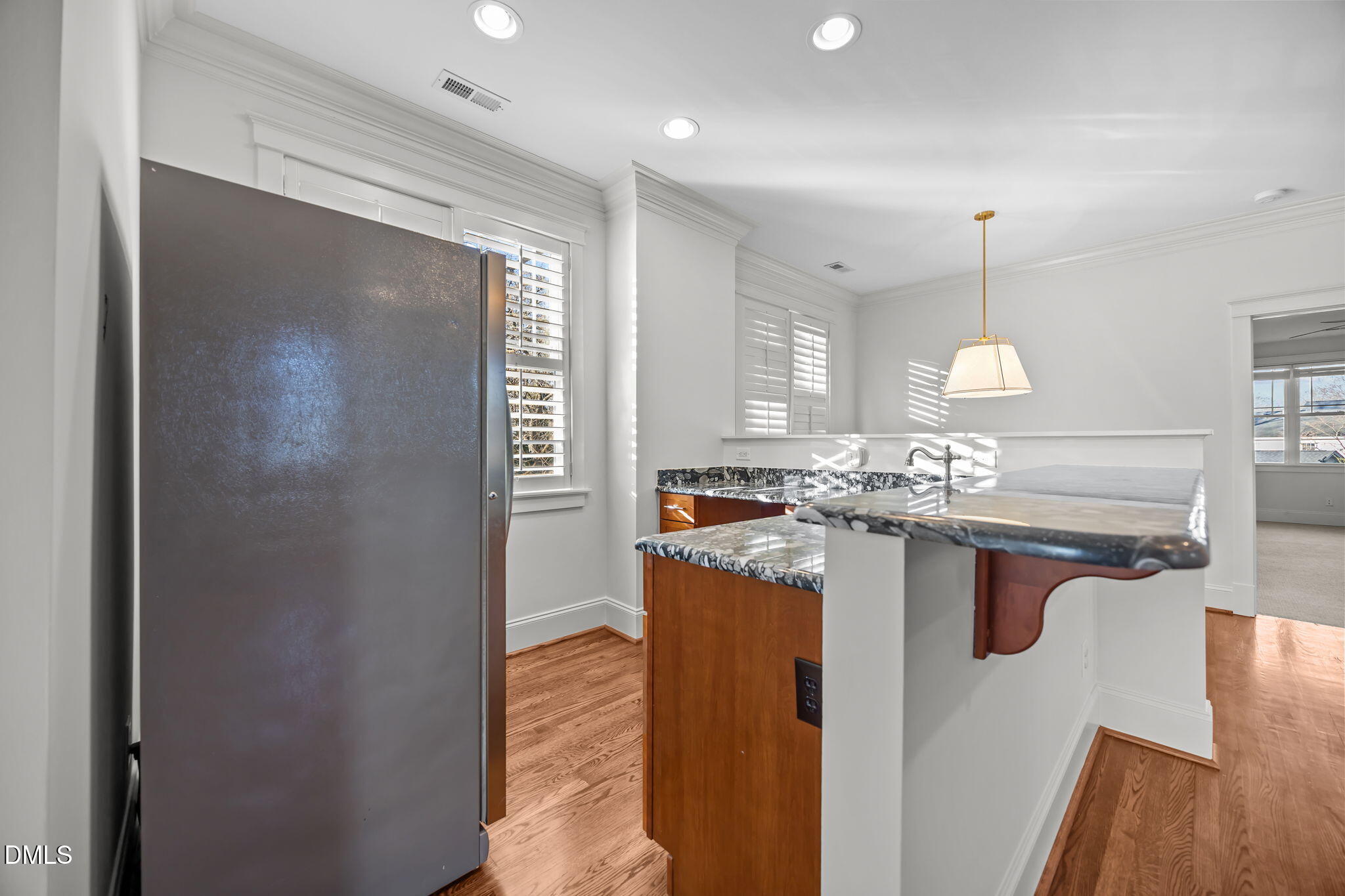 1705 Carson Street Raleigh, NC 27608 - Photo 34 of 47 a kitchen with a sink and a refrigerator