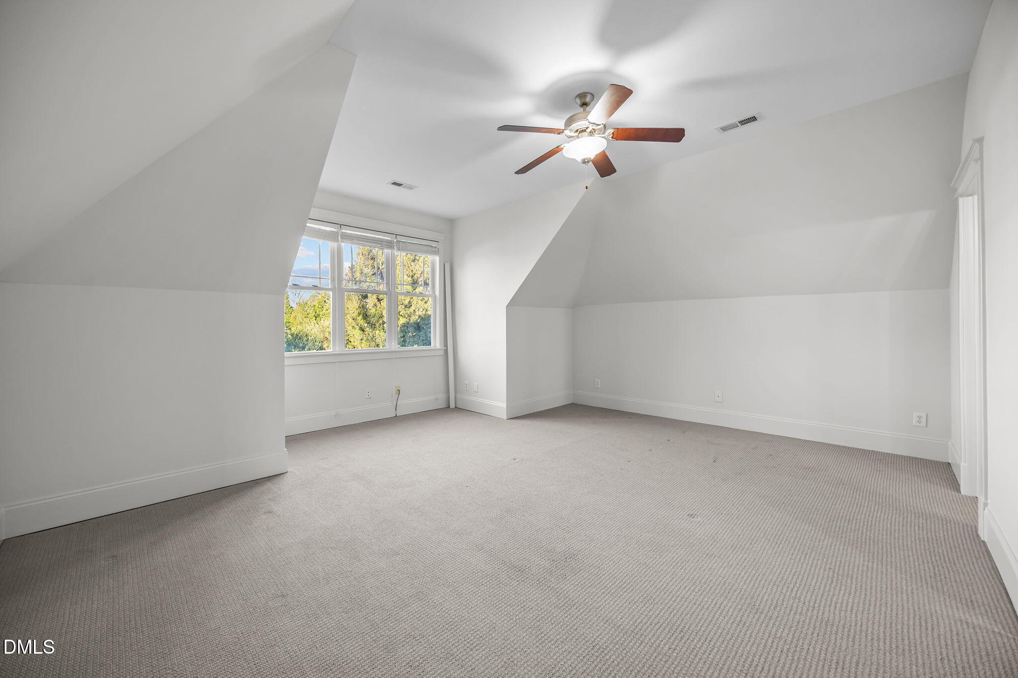 1705 Carson Street Raleigh, NC 27608 - Photo 35 of 47 an empty room with windows and chandelier fan