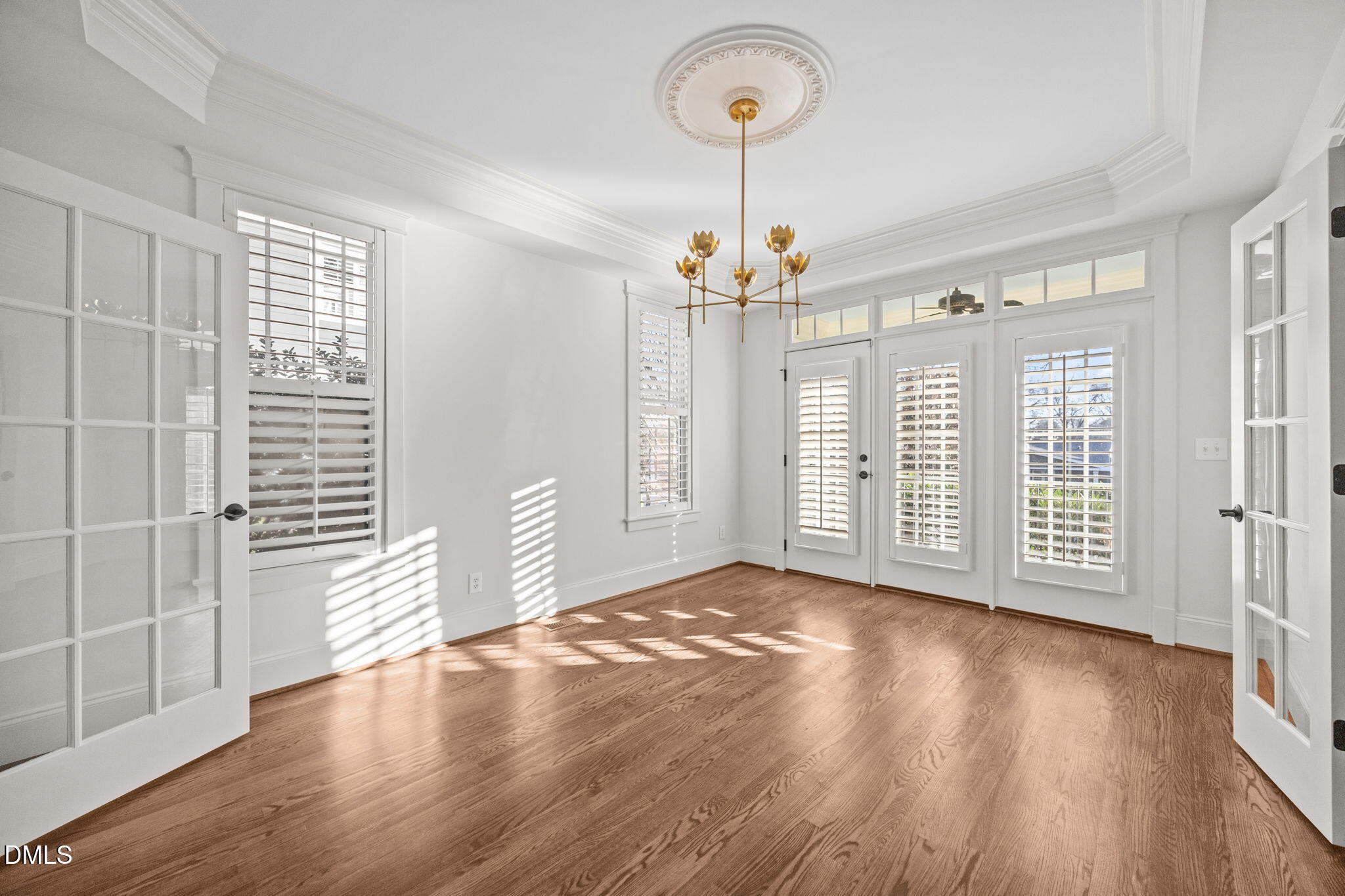 1705 Carson Street Raleigh, NC 27608 - Photo 5 of 47 a view of an empty room with wooden floor and a window