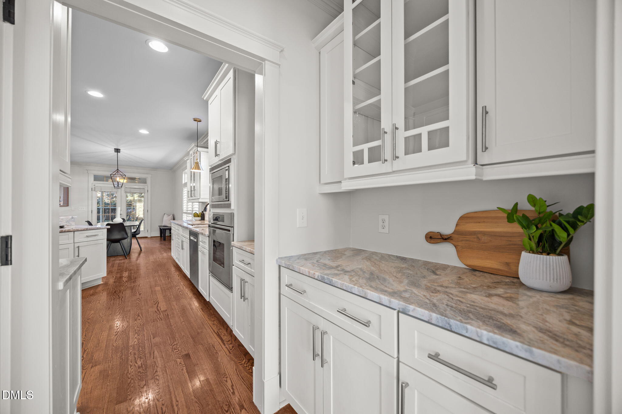 1705 Carson Street Raleigh, NC 27608 - Photo 6 of 47 a hallway with a sink and cabinets