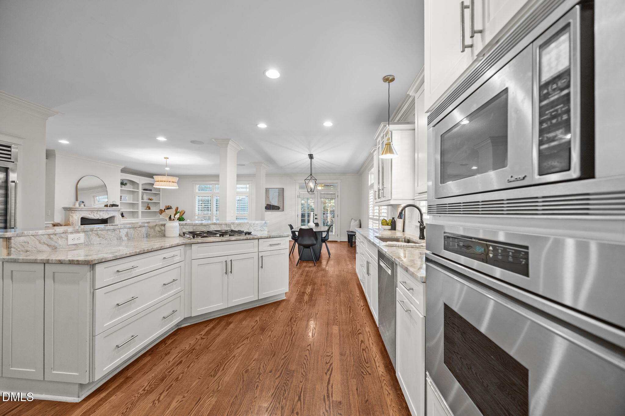 1705 Carson Street Raleigh, NC 27608 - Photo 7 of 47 a kitchen with stainless steel appliances granite countertop lots of counter top space and wooden floor