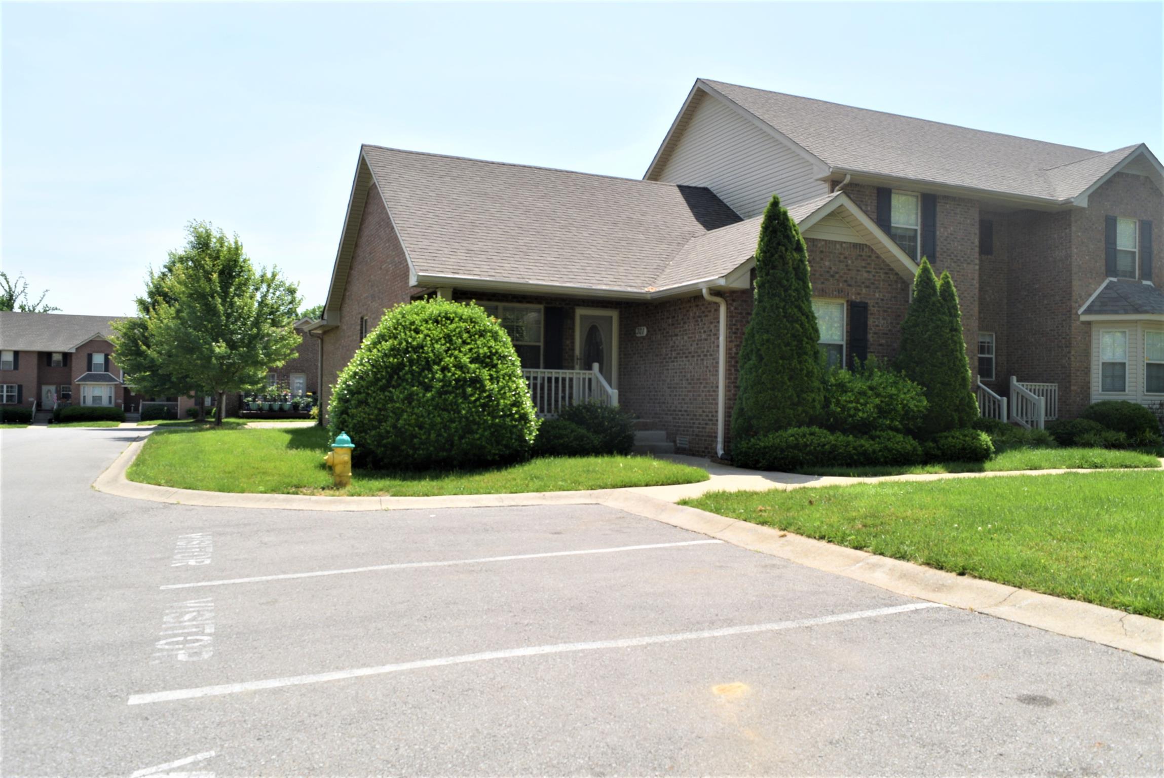 135 Excell Road, Unit 301 Clarksville, TN 37043 - Photo 2 of 5 a house view with a garden space