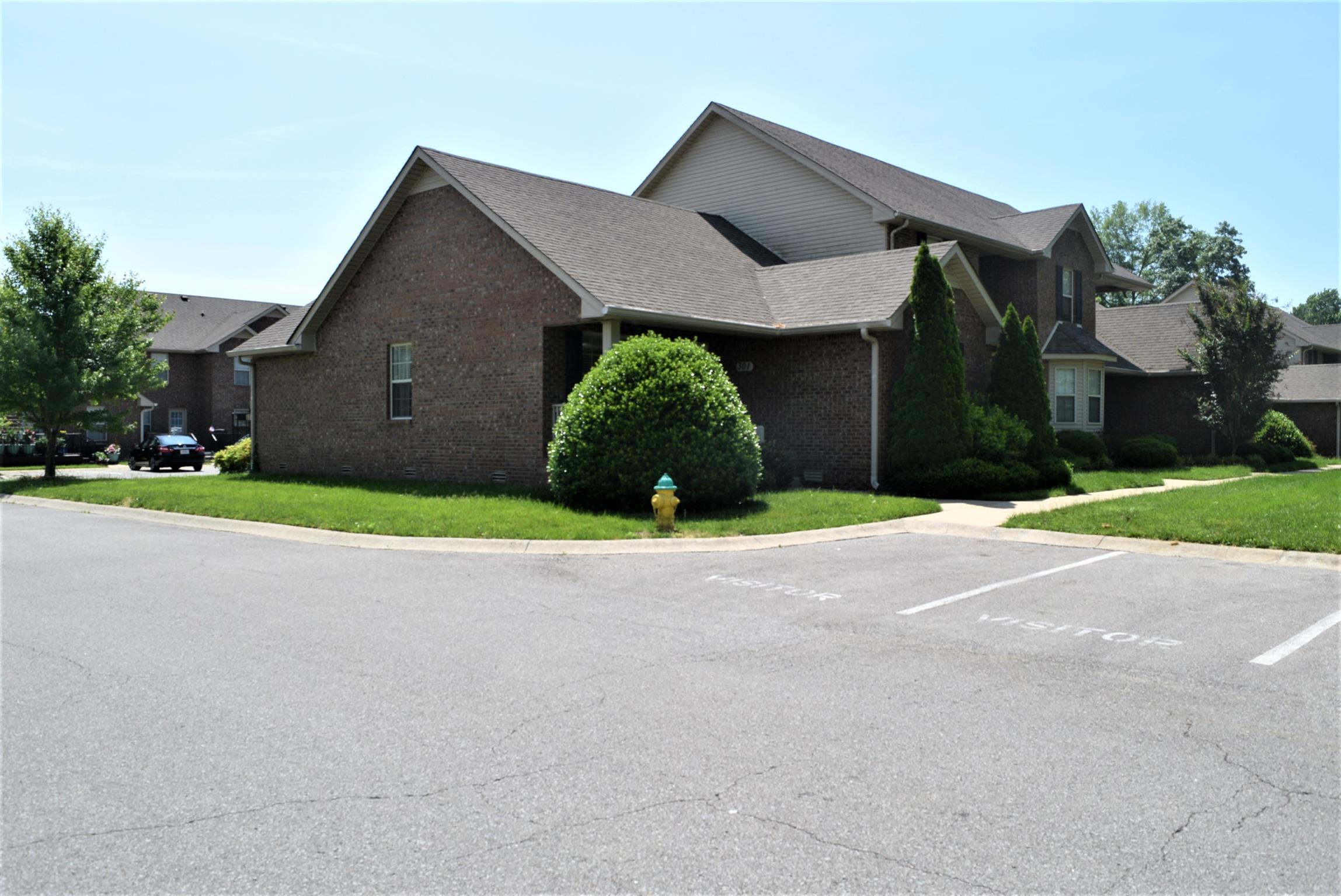 135 Excell Road, Unit 301 Clarksville, TN 37043 - Photo 3 of 5 a house with yard and a outdoor space