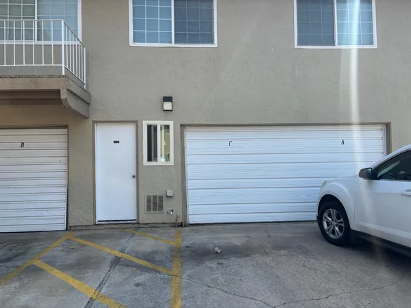 a view of a garage and car parked