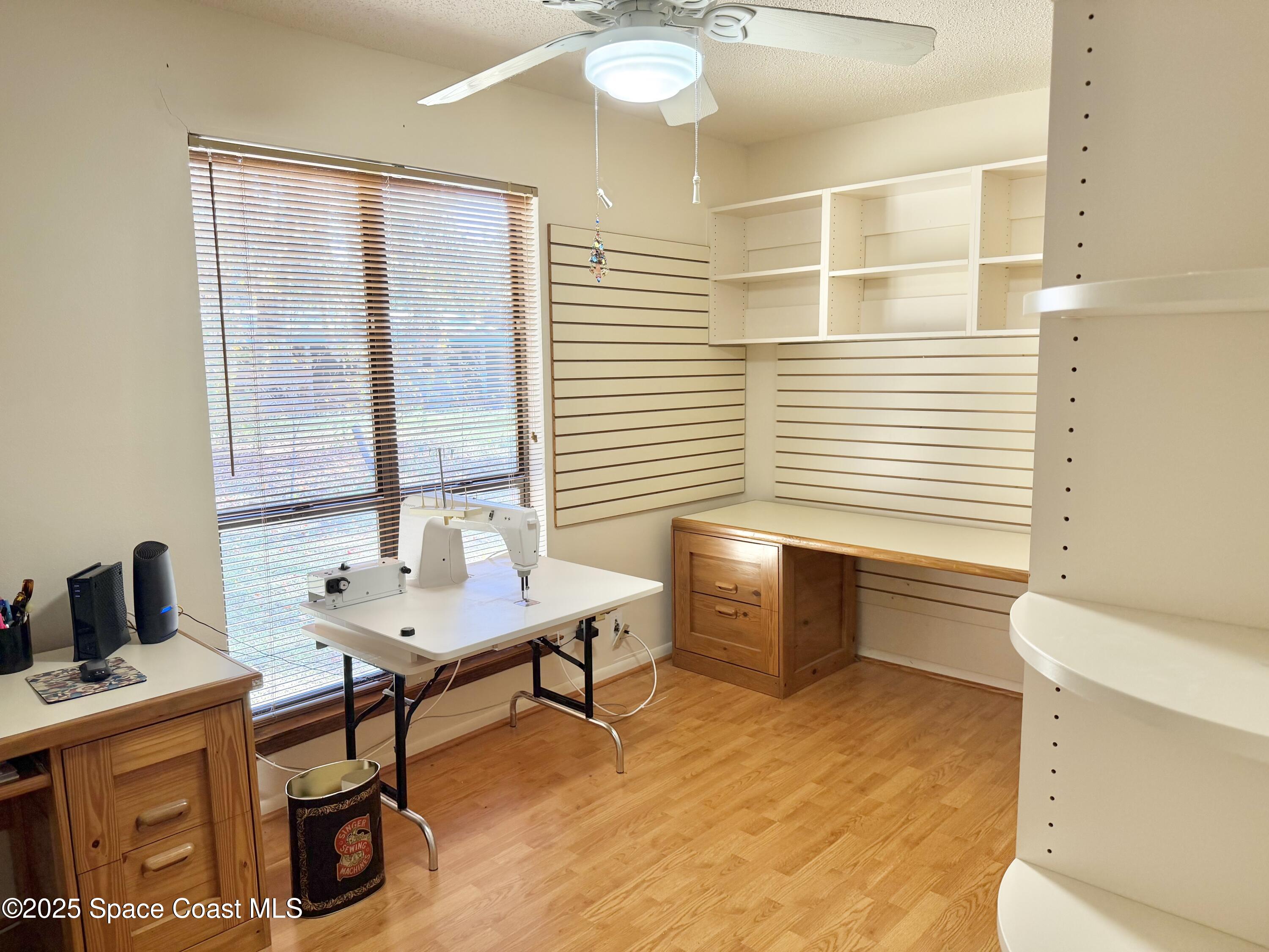 265 Mockingbird Lane Merritt Island, FL 32953 - Photo 22 of 34 a bathroom with a sink a toilet and a window