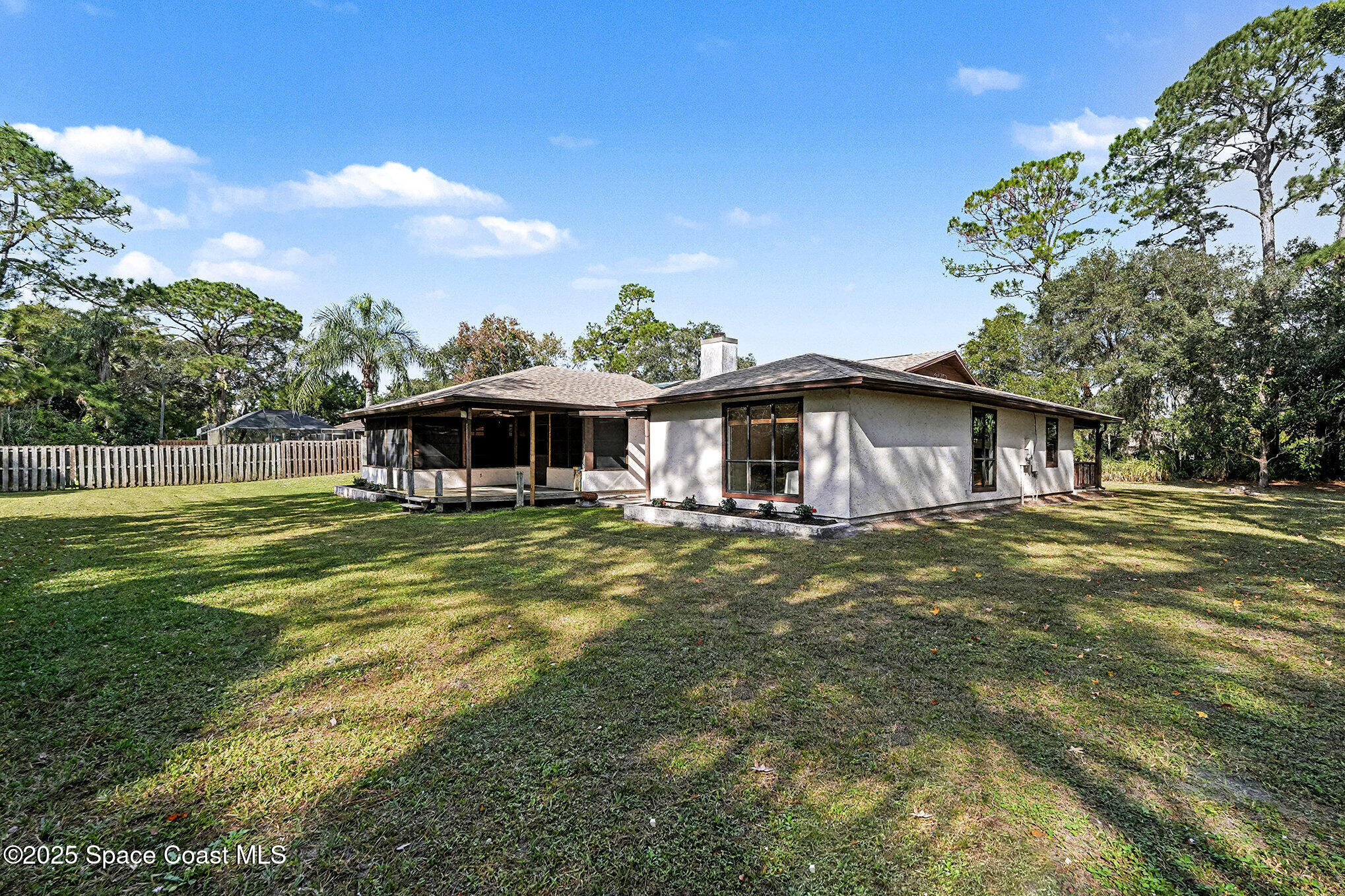 265 Mockingbird Lane Merritt Island, FL 32953 - Photo 24 of 34 a front view of a house with a garden