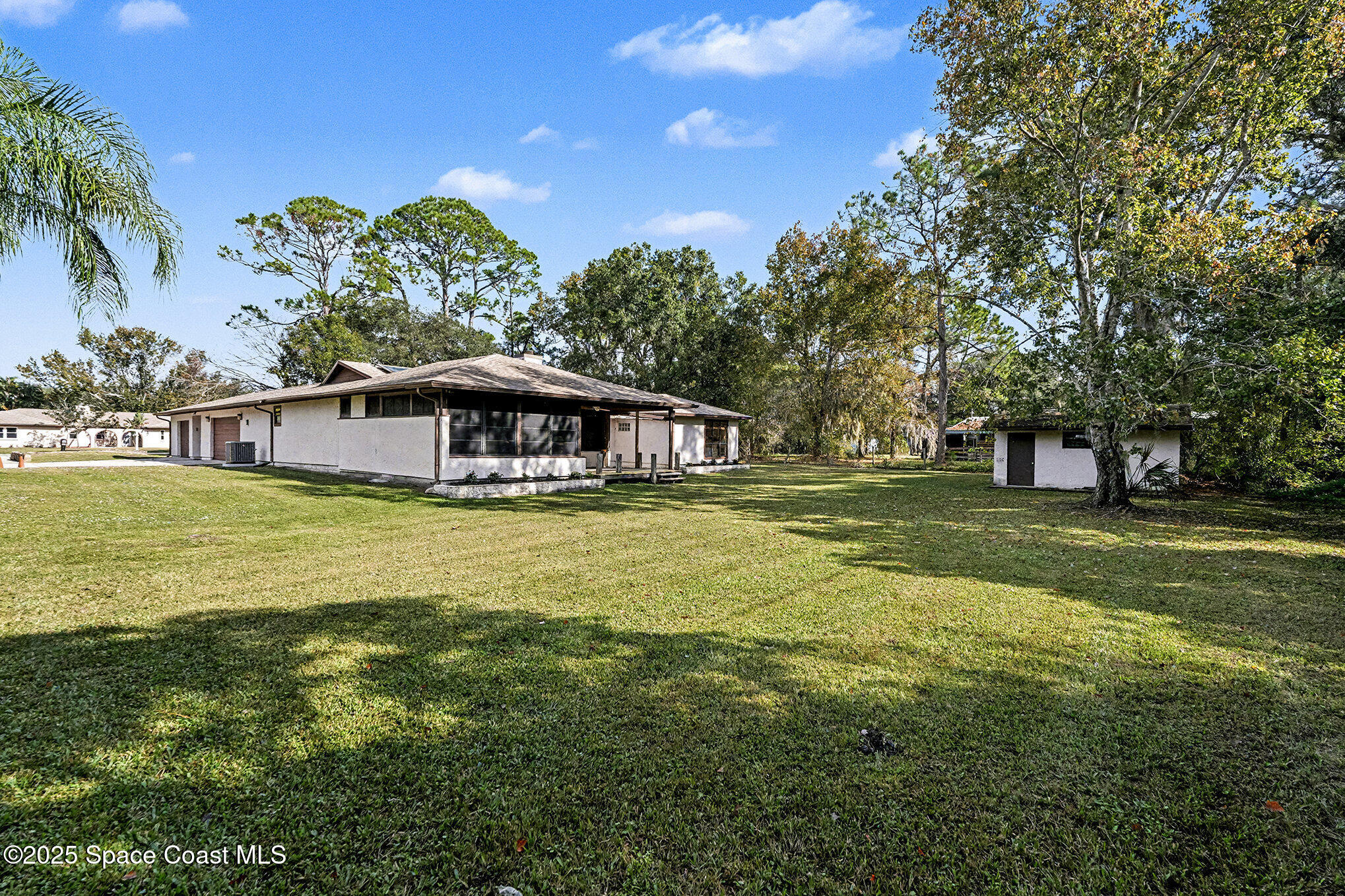 265 Mockingbird Lane Merritt Island, FL 32953 - Photo 25 of 34 a house with swimming pool in front of it