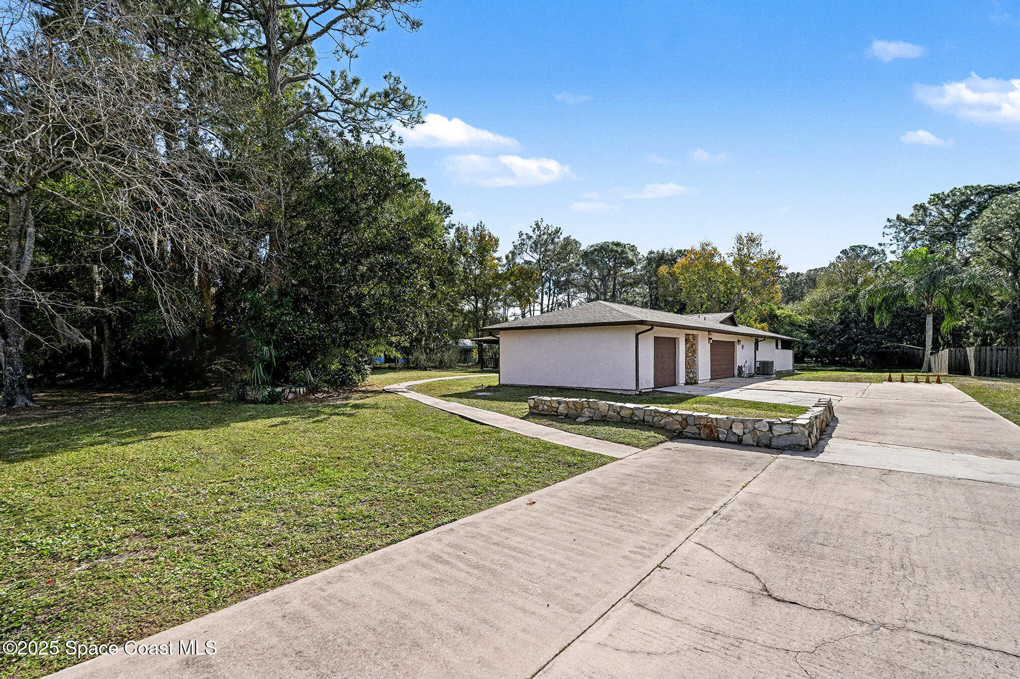 265 Mockingbird Lane Merritt Island, FL 32953 - Photo 27 of 34 a view of a house with a yard