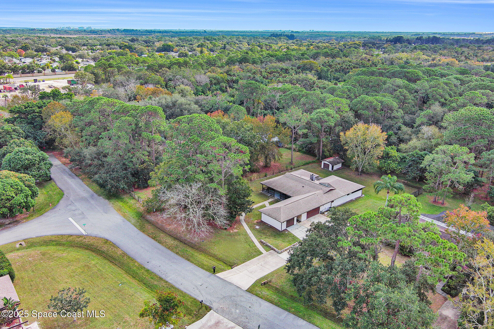 265 Mockingbird Lane Merritt Island, FL 32953 - Photo 28 of 34 an aerial view of a house with a yard