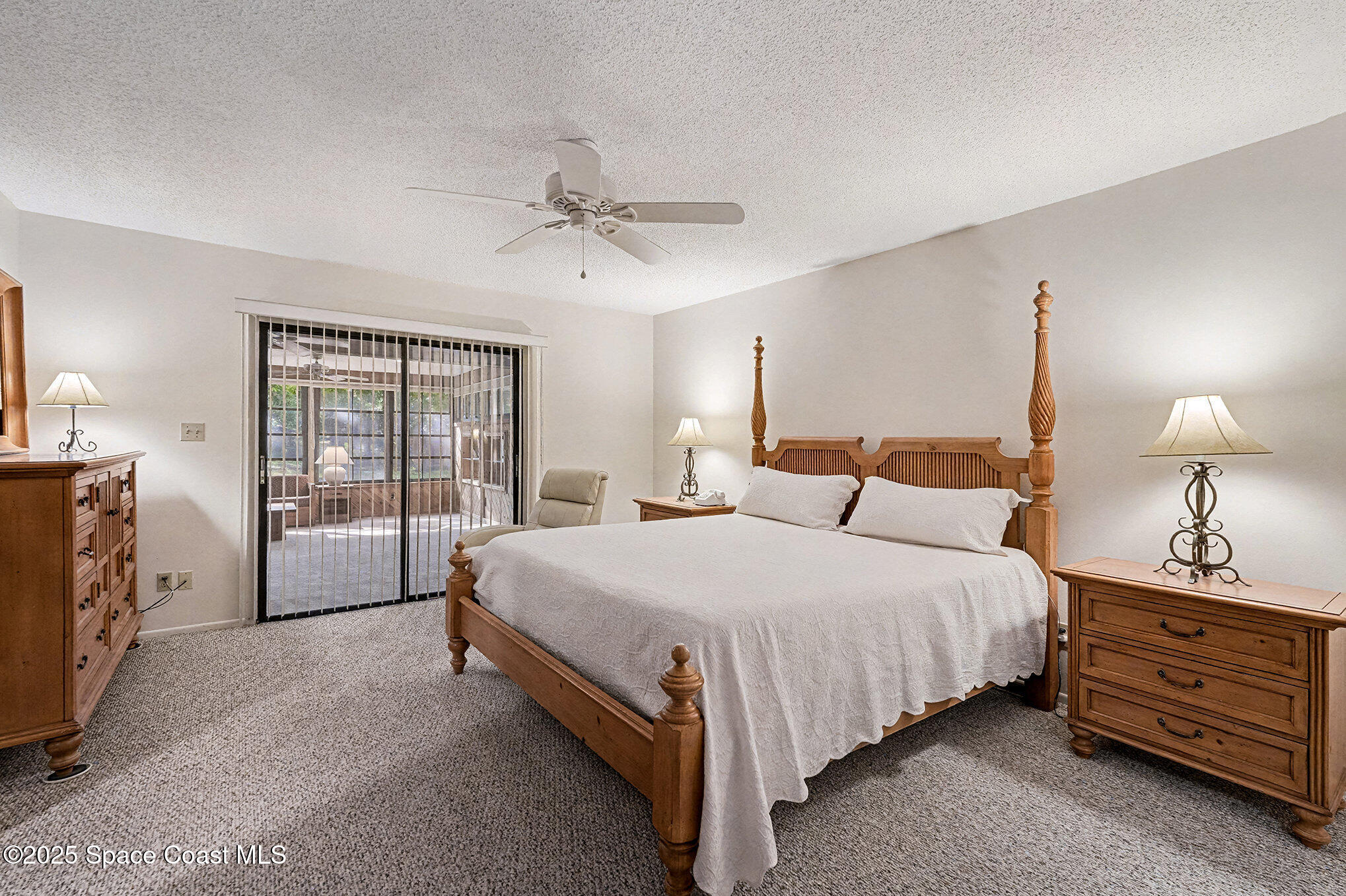 265 Mockingbird Lane Merritt Island, FL 32953 - Photo 3 of 34 a bed room with a bed and a night stand