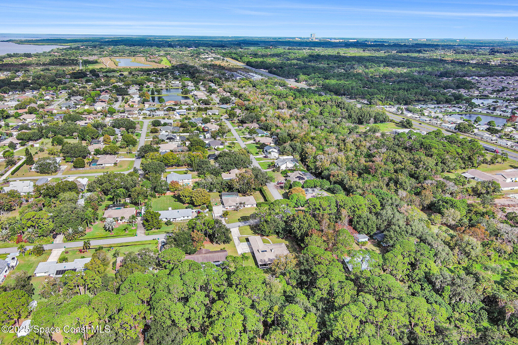265 Mockingbird Lane Merritt Island, FL 32953 - Photo 31 of 34 a view of a green field with lots of bushes