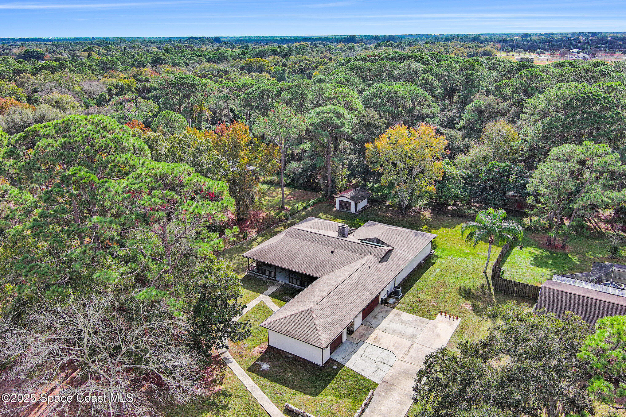 265 Mockingbird Lane Merritt Island, FL 32953 - Photo 32 of 34 an aerial view of a house with a yard