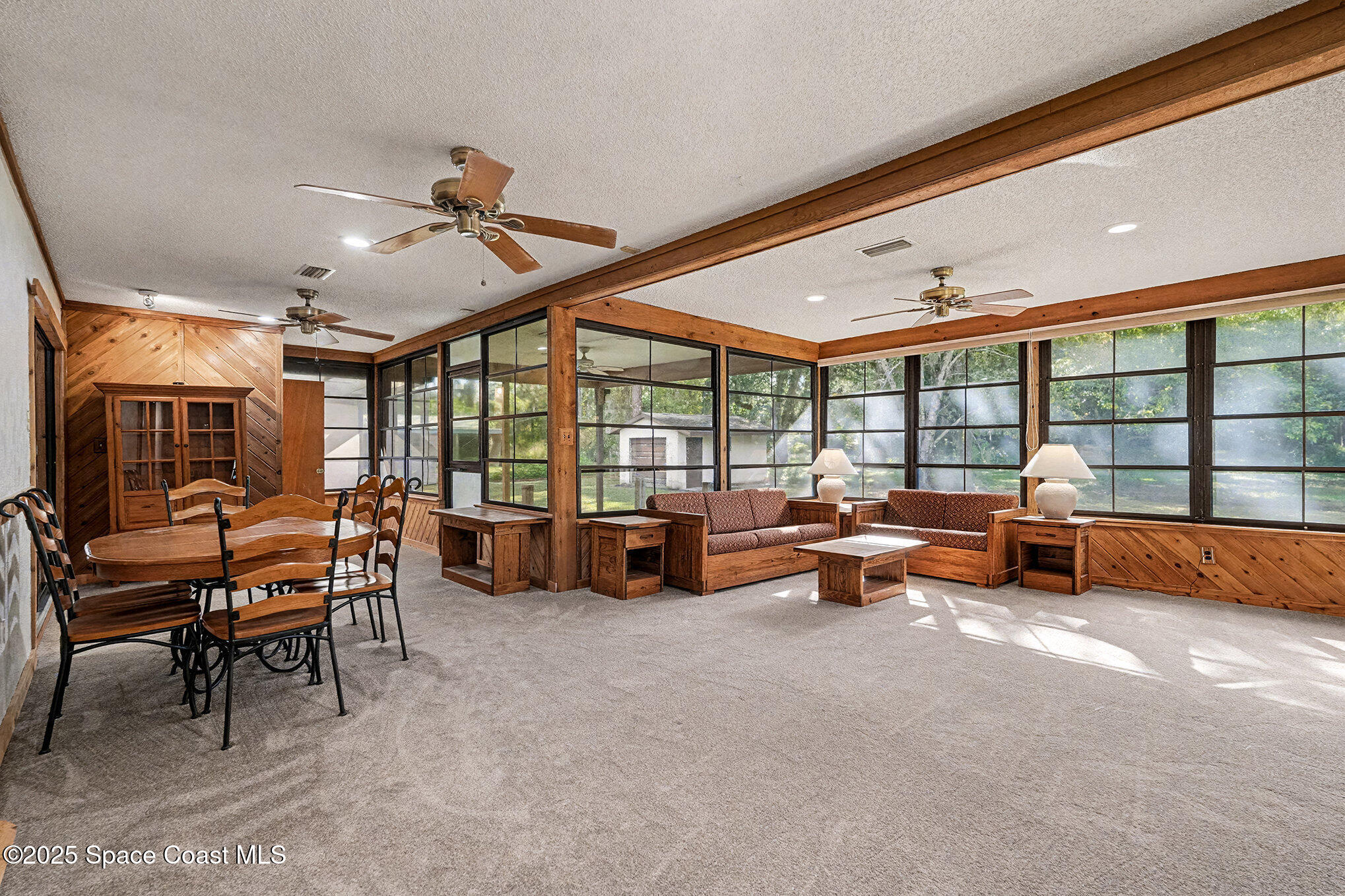 265 Mockingbird Lane Merritt Island, FL 32953 - Photo 5 of 34 a living room with furniture and a large window