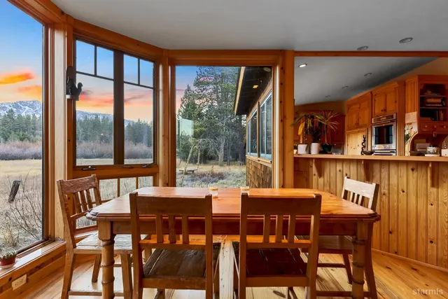a open kitchen with stainless steel appliances granite countertop a stove and refrigerator