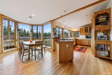 a kitchen with a stove a sink and a refrigerator