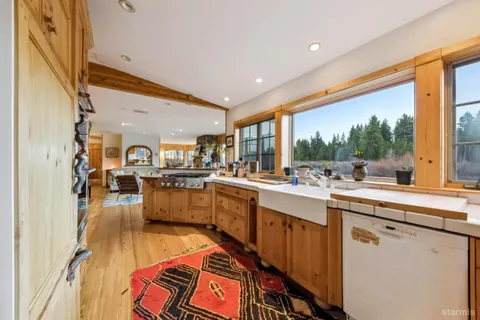 a kitchen with stainless steel appliances granite countertop a stove and a refrigerator