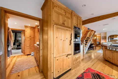 a living room with furniture ceiling fan and a rug