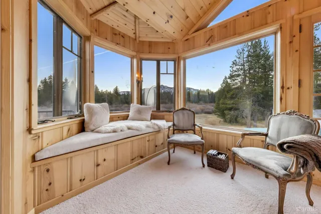 a spacious bathroom with a double vanity sink and a large mirror