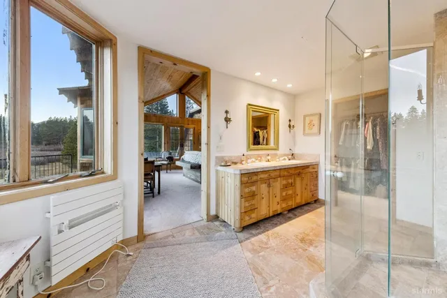 a bathroom with a bathtub and shower