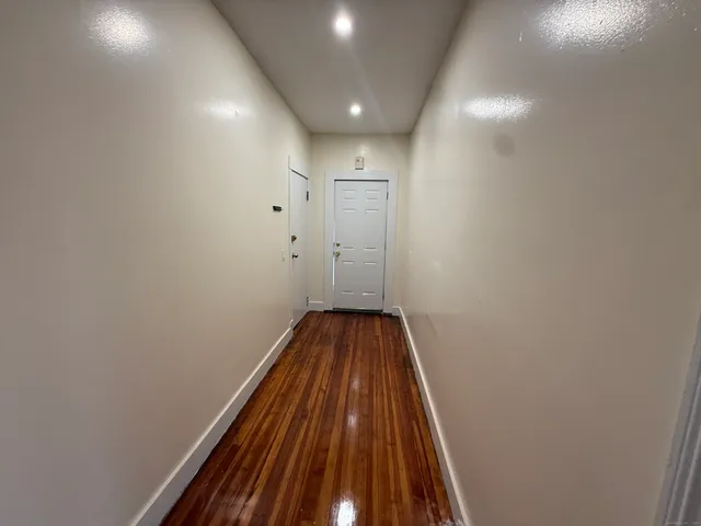 a kitchen with stainless steel appliances granite countertop wooden cabinets a sink and a stove