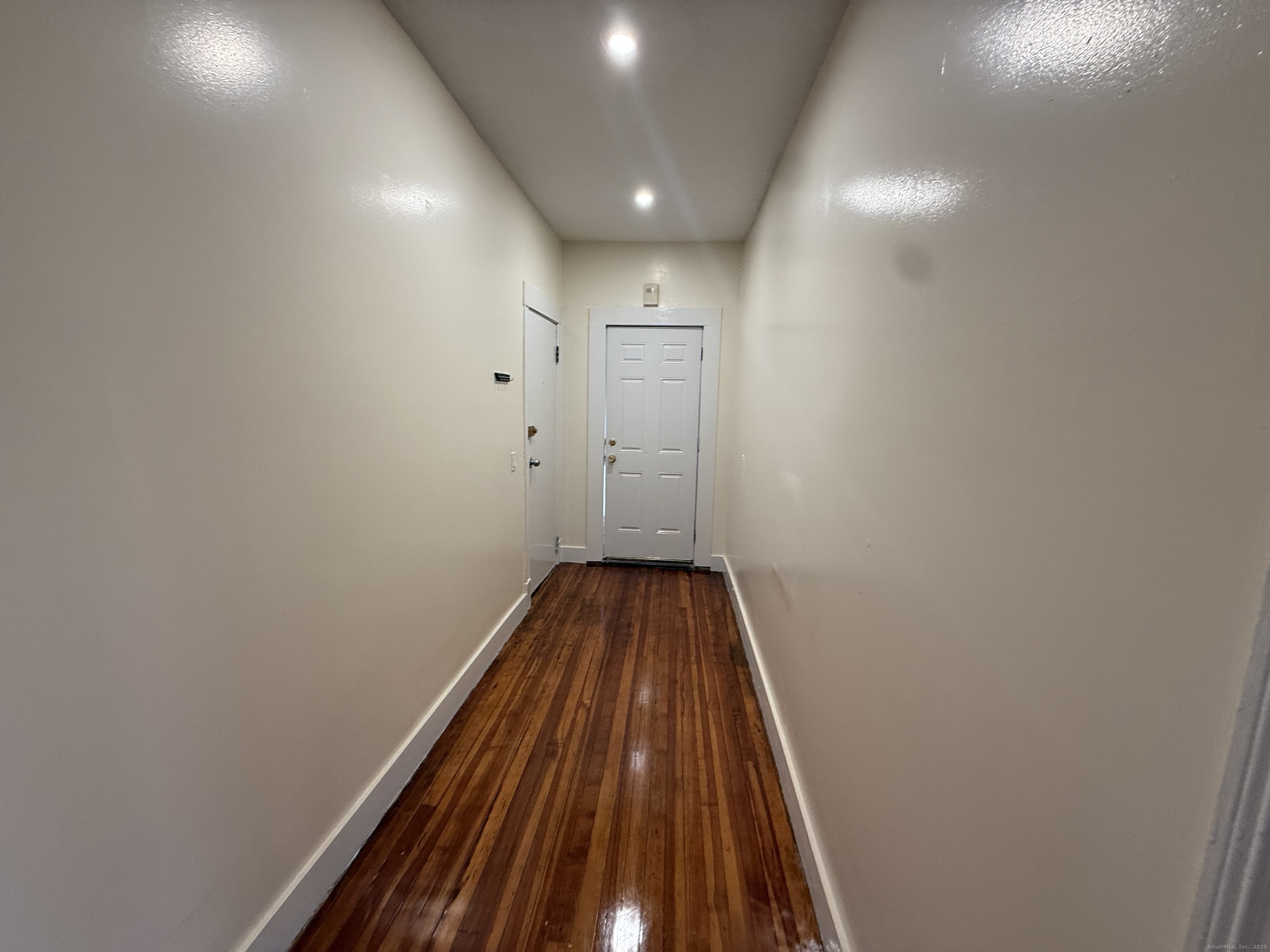 204 Homestead Avenue, Unit 3 Hartford, CT 06112 - Photo 5 of 7 a view of a hallway with wooden floor