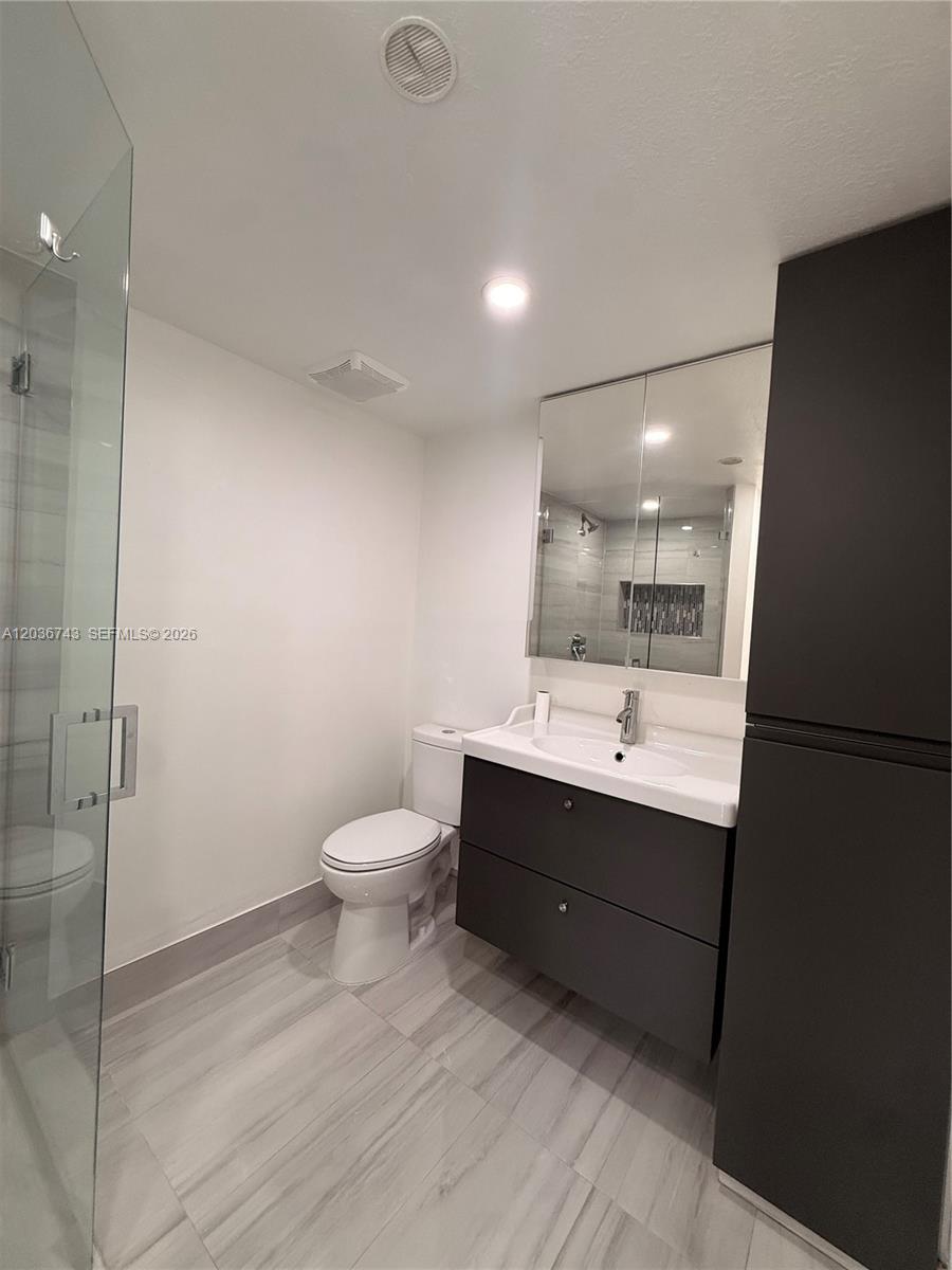 10875 Northwest 7th Street, Unit 1136 Miami, FL 33172 - Photo 20 of 25 a bathroom with a sink toilet and shower
