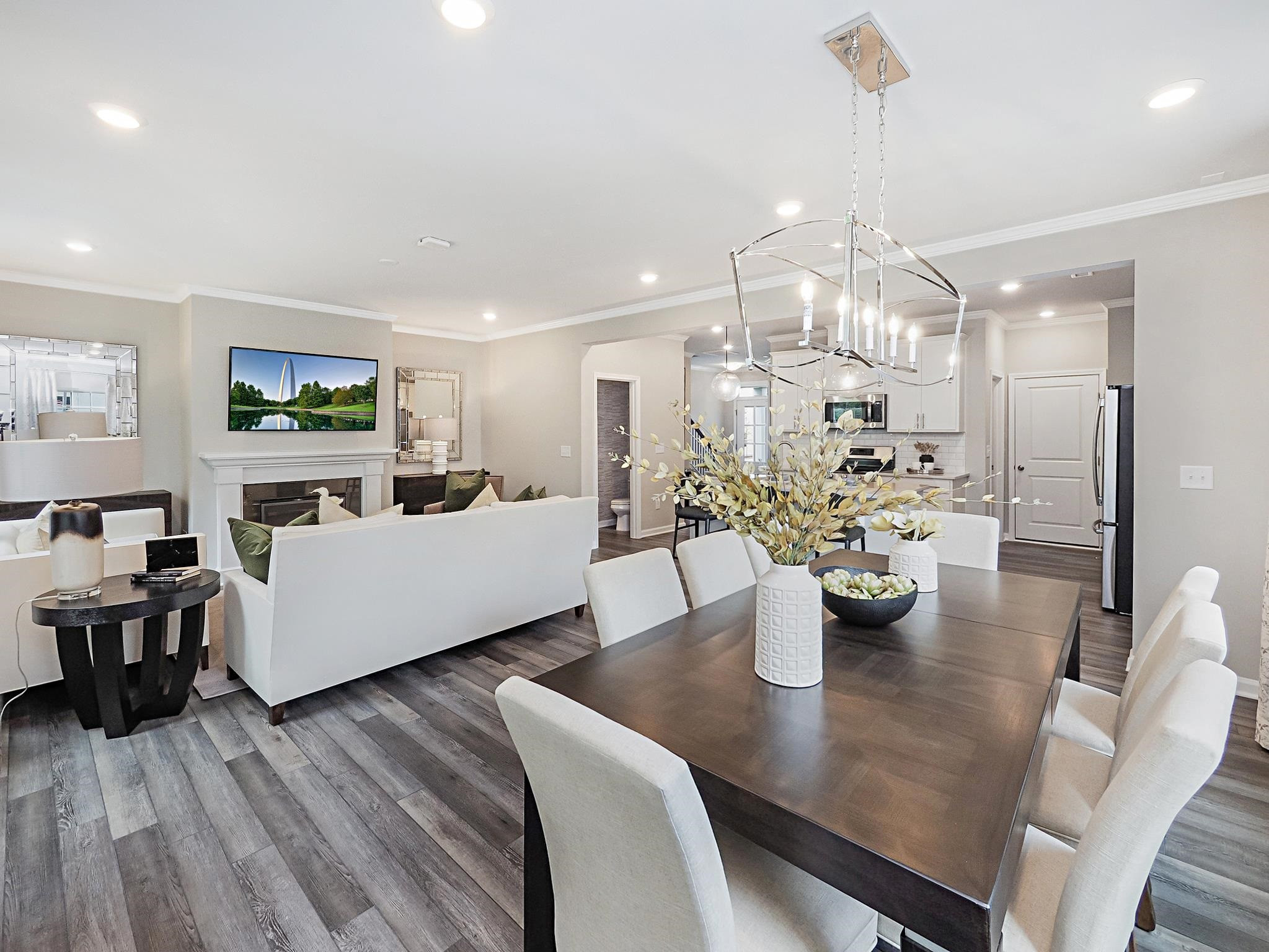 5819 Millstone Way Sims, NC 27880 - Photo 6 of 19 a living room with couches and a dining table with wooden floor
