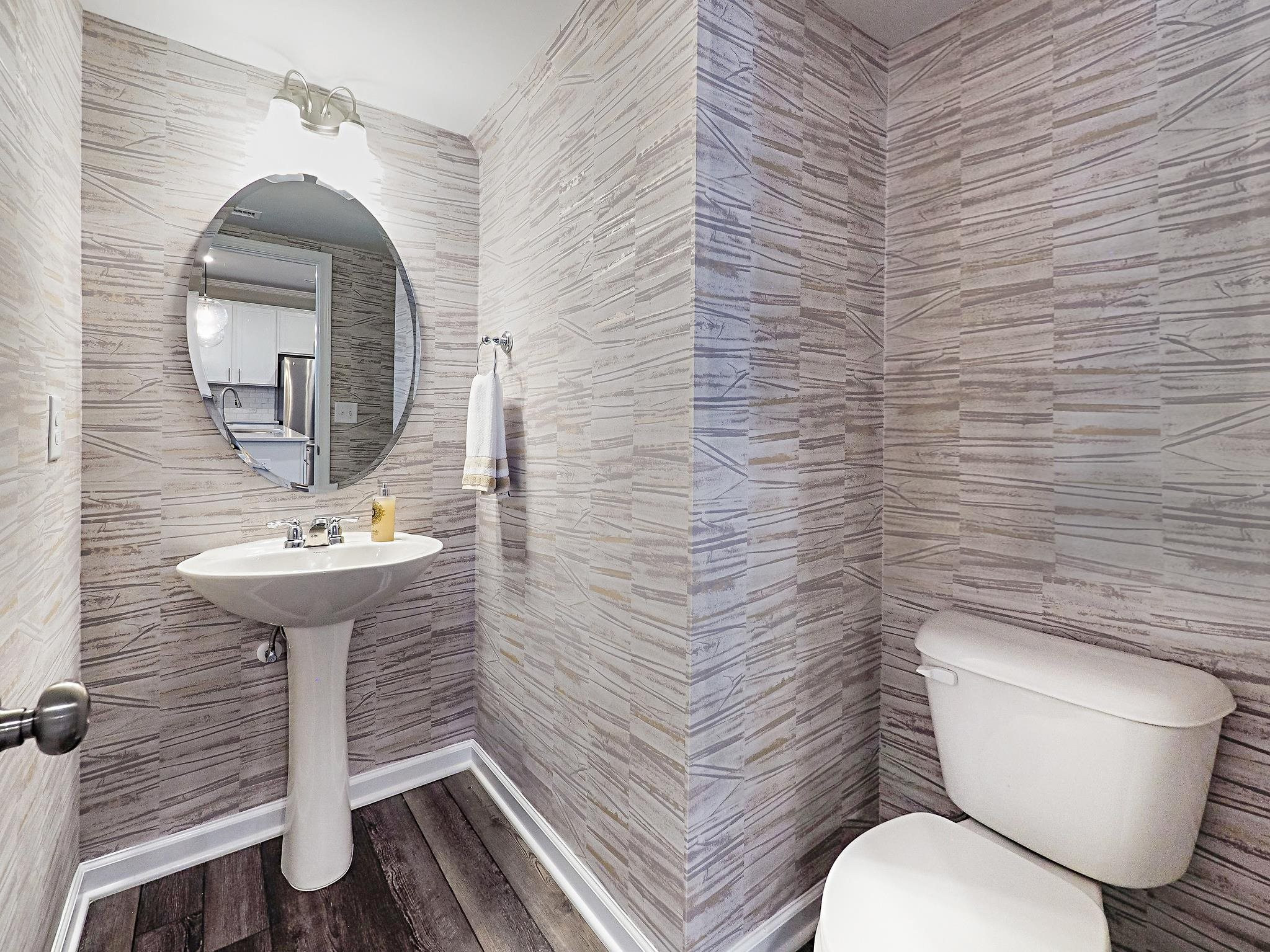 5819 Millstone Way Sims, NC 27880 - Photo 9 of 19 a bathroom with a toilet a sink and mirror