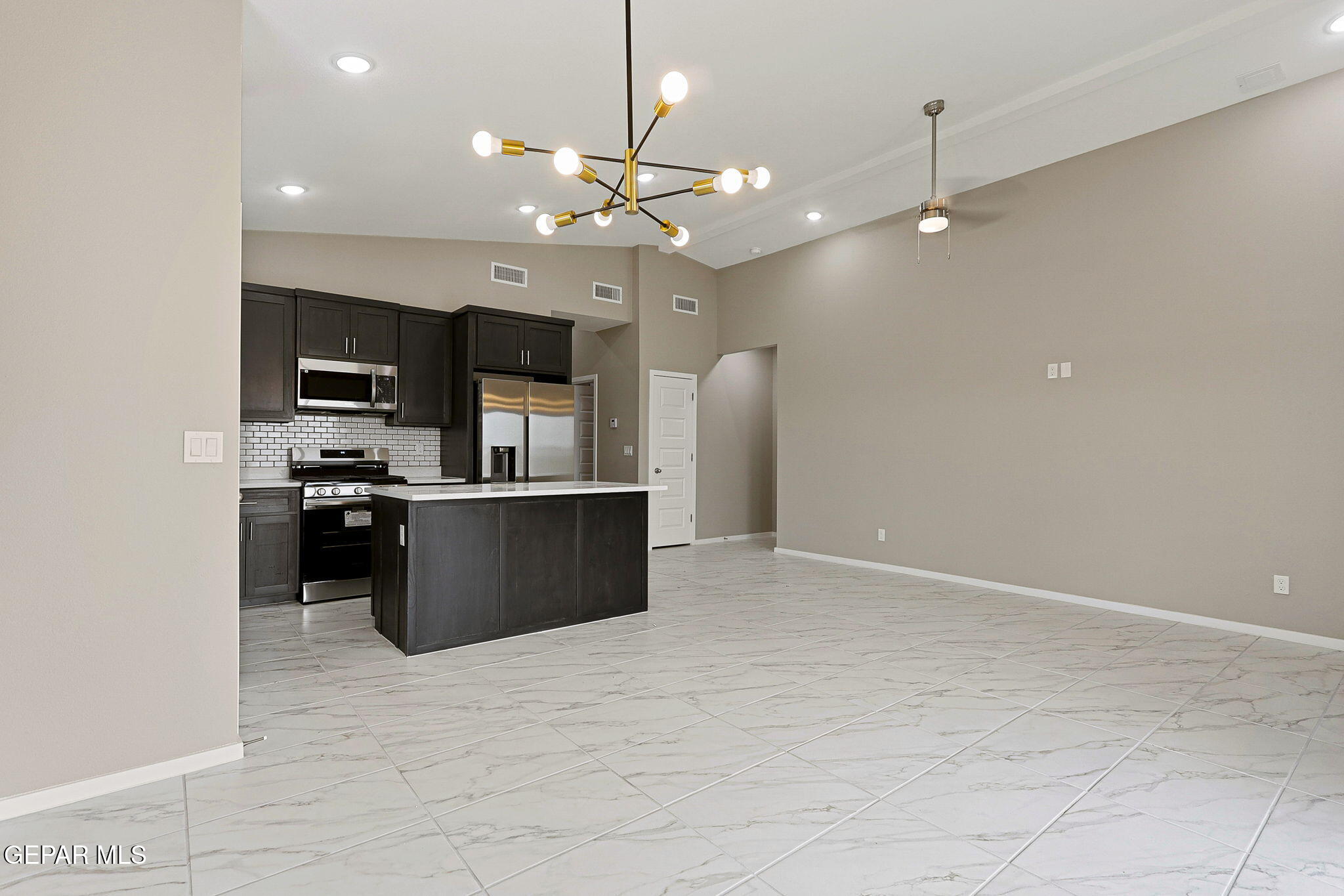 8416 Fish Place Vinton, TX 79821 - Photo 2 of 20 a view of kitchen with refrigerator and microwave