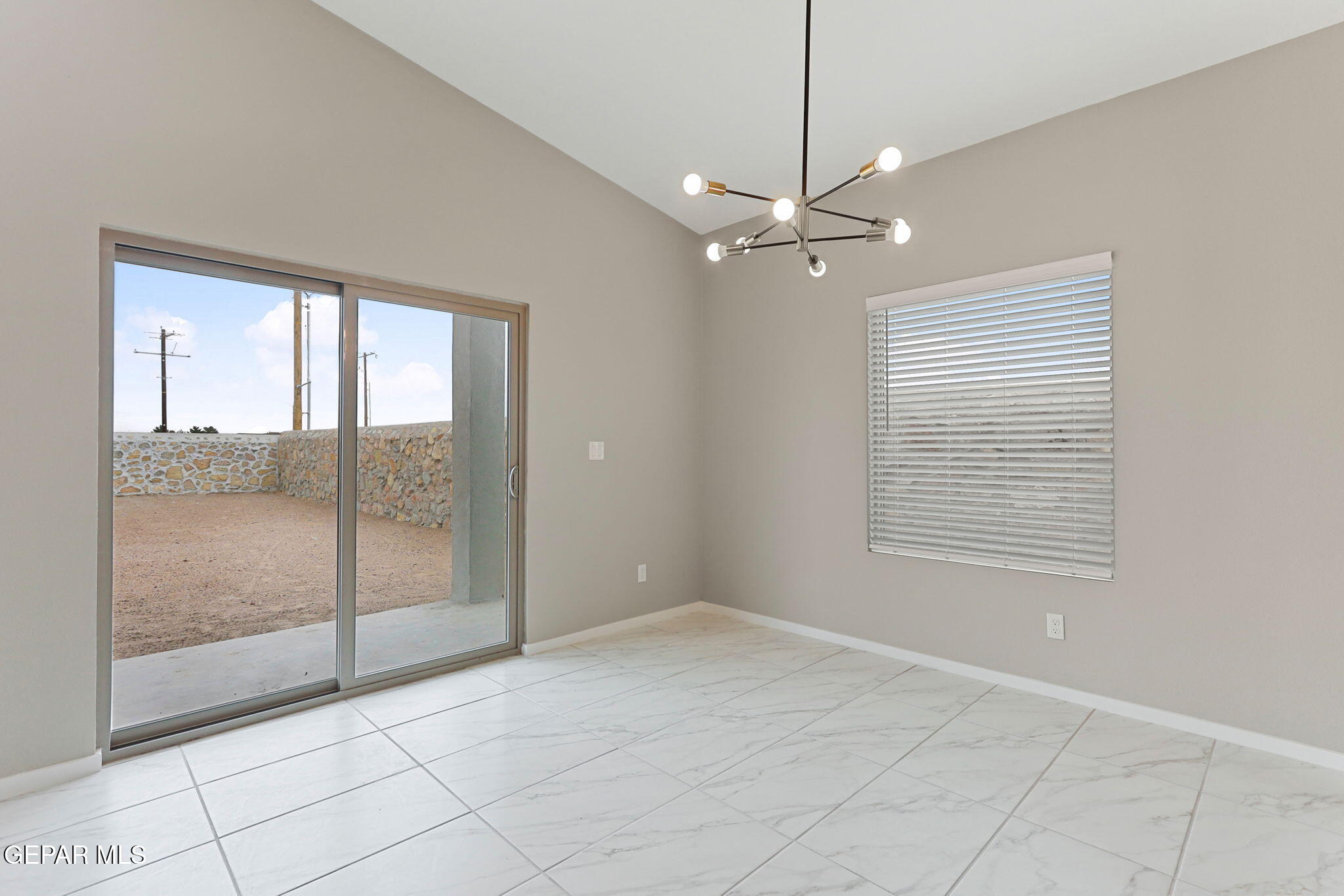 8416 Fish Place Vinton, TX 79821 - Photo 3 of 20 a view of an empty room with glass door