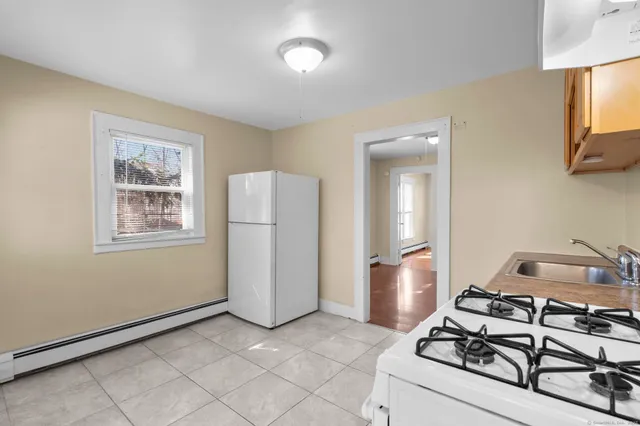 a view of a livingroom with furniture and a window