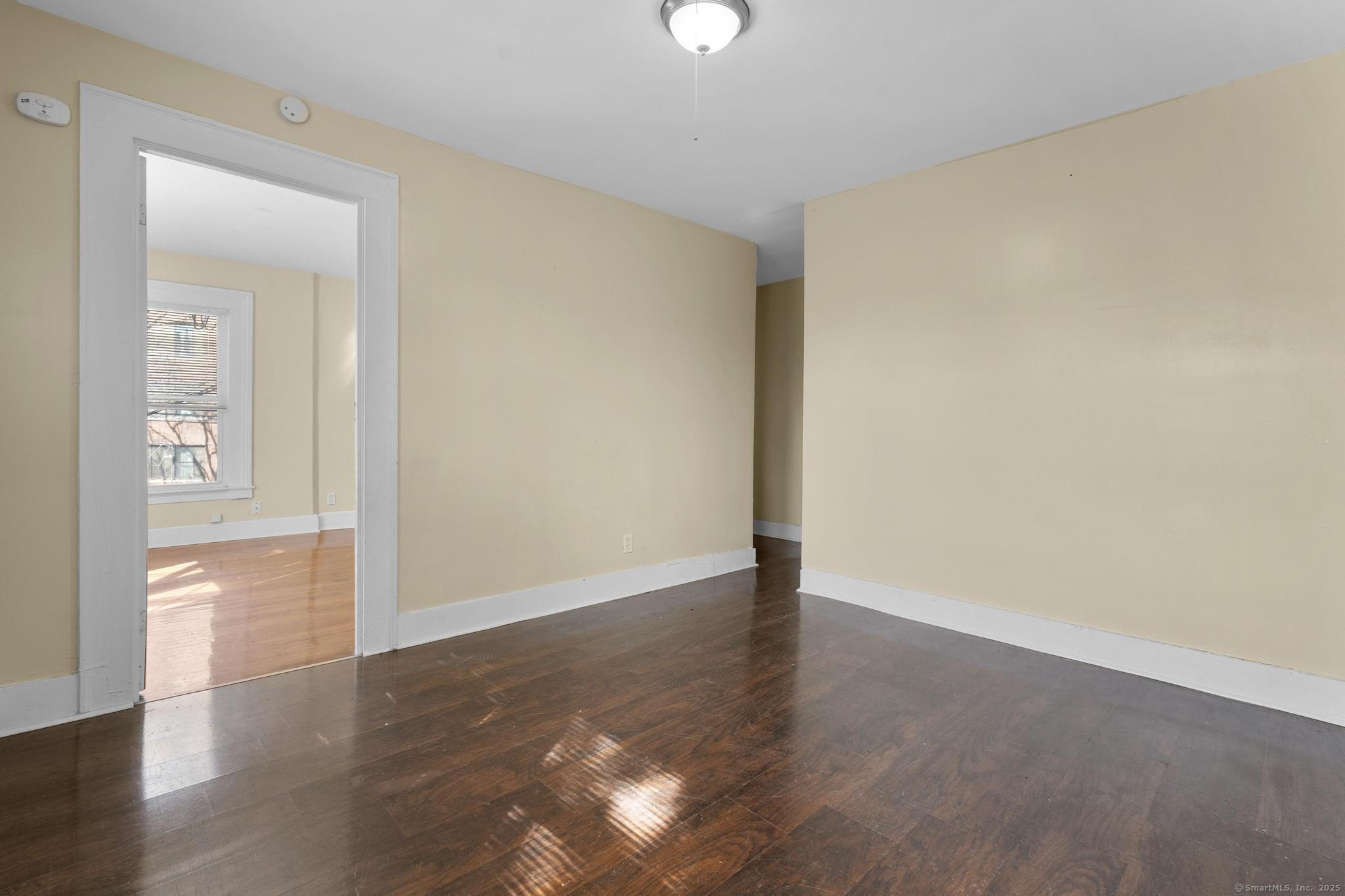 122 Derby Avenue New Haven, CT 06511 - Photo 13 of 26 an empty room with wooden floor and windows