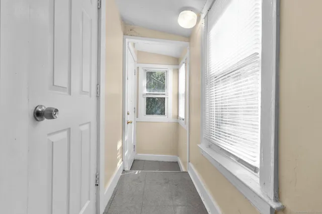 a view of a bathroom from a hallway