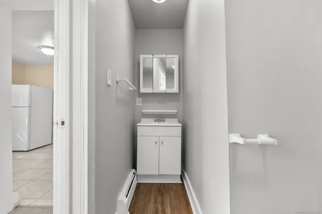 a bathroom with a sink and a mirror