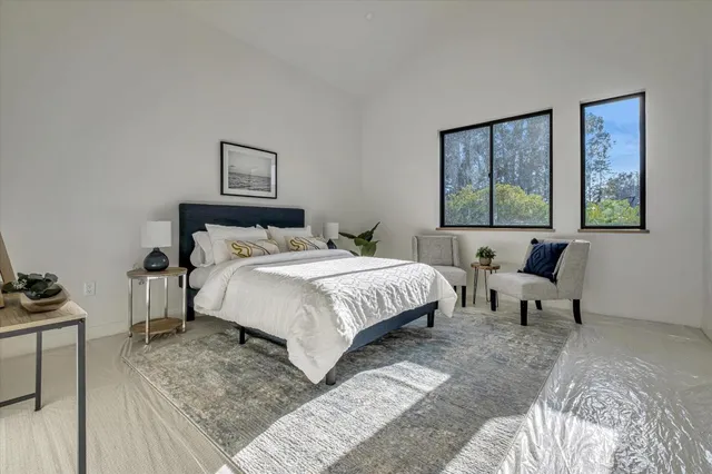 a bedroom with a bed and a couch