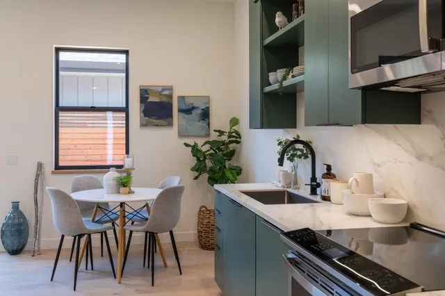 a dining room with furniture and window