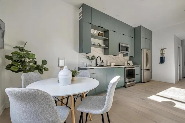 a dining room with furniture and chandelier
