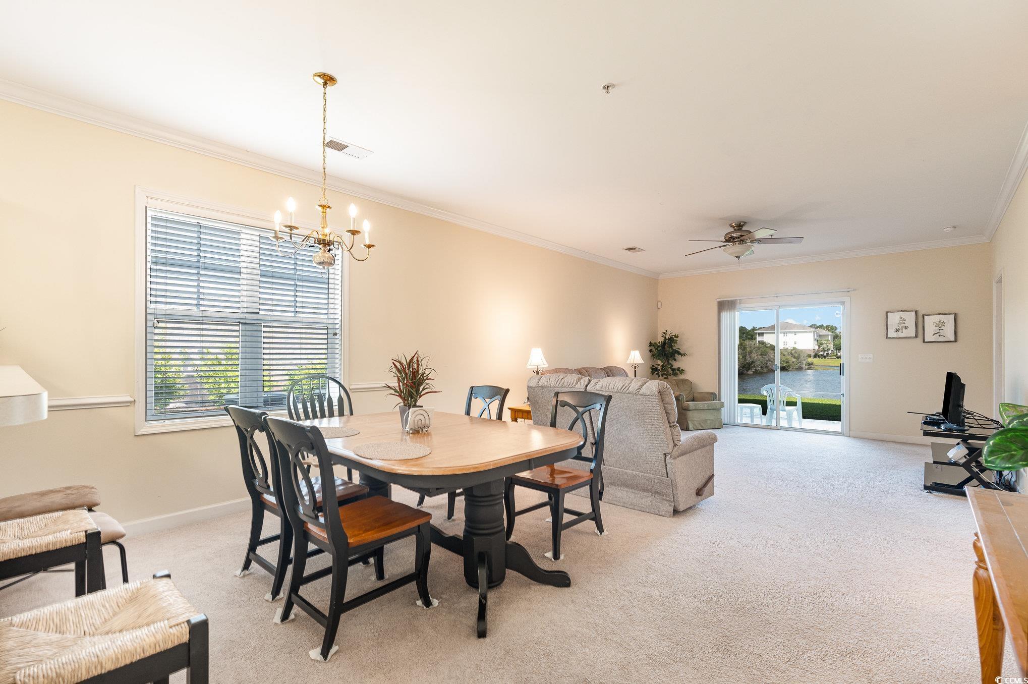 336 Kiskadee Loop, Unit A Conway, SC 29526 - Photo 10 of 27 Dining space with ceiling fan with notable chandel