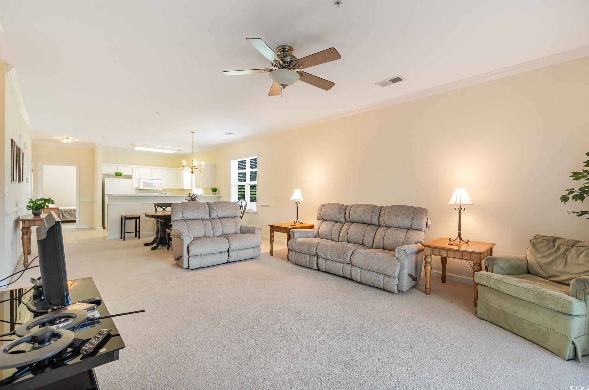 336 Kiskadee Loop, Unit A Conway, SC 29526 - Photo 11 of 27 Living room with light carpet, ceiling fan with no