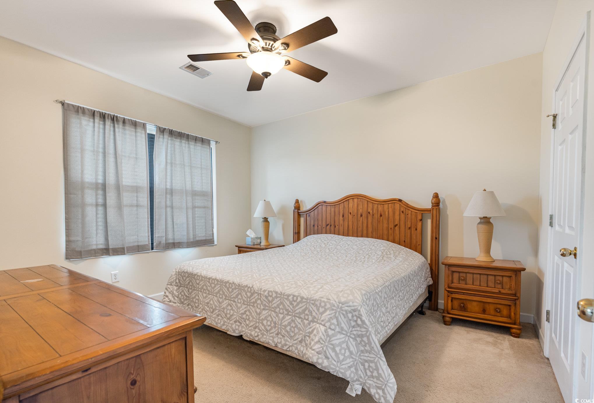 336 Kiskadee Loop, Unit A Conway, SC 29526 - Photo 17 of 27 Bedroom with ceiling fan and light colored carpet