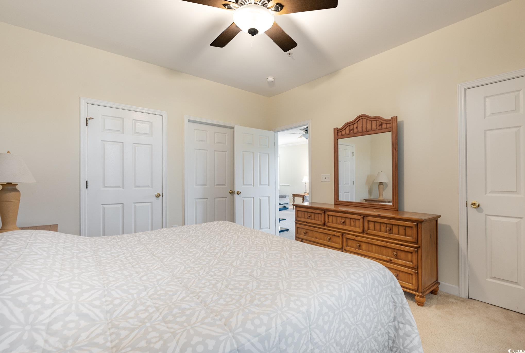 336 Kiskadee Loop, Unit A Conway, SC 29526 - Photo 18 of 27 Carpeted bedroom with ceiling fan and two closets