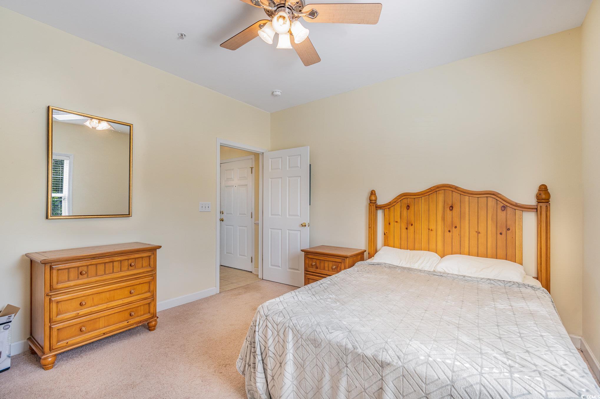 336 Kiskadee Loop, Unit A Conway, SC 29526 - Photo 19 of 27 Carpeted bedroom with ceiling fan