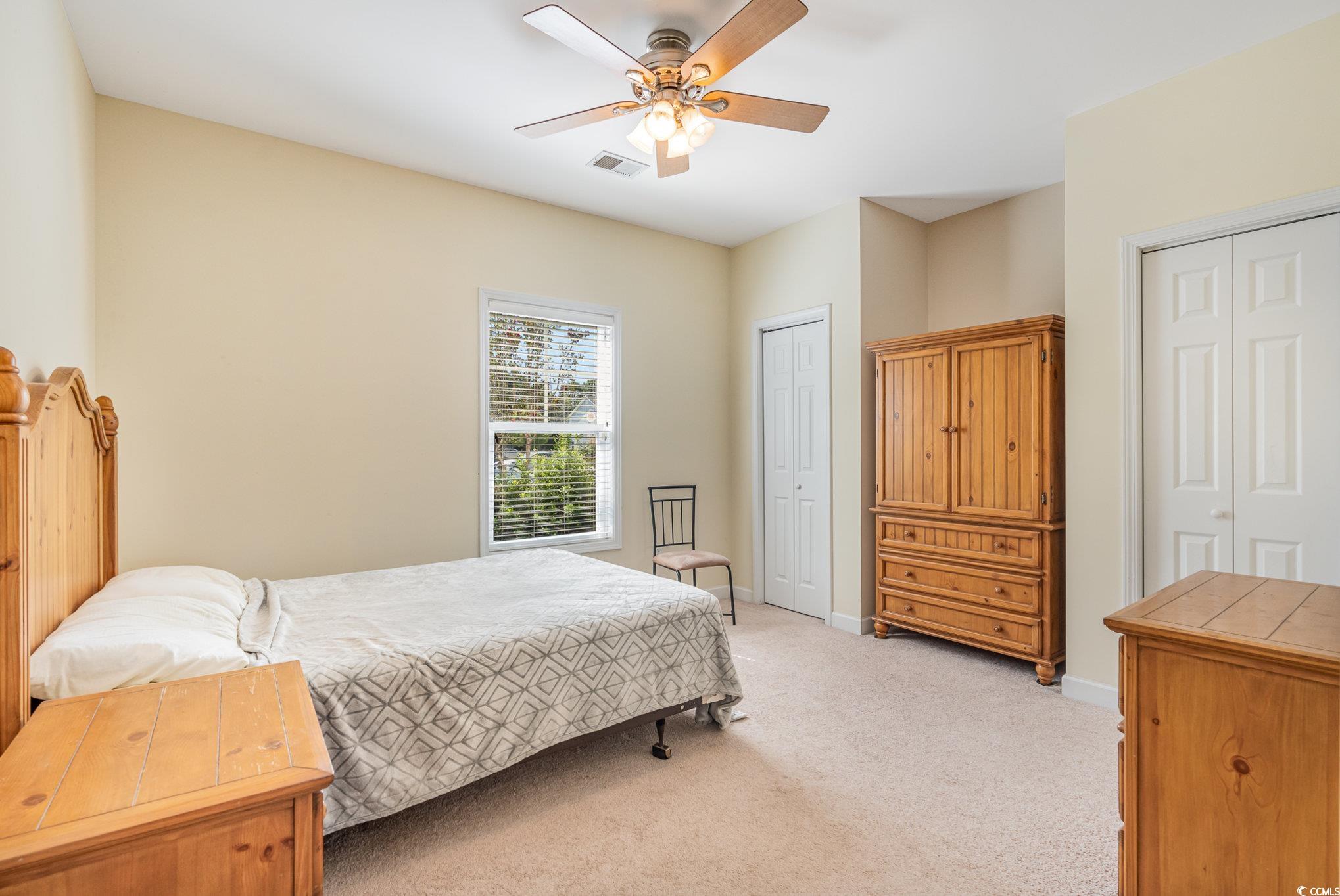 336 Kiskadee Loop, Unit A Conway, SC 29526 - Photo 20 of 27 Carpeted bedroom with ceiling fan and multiple clo