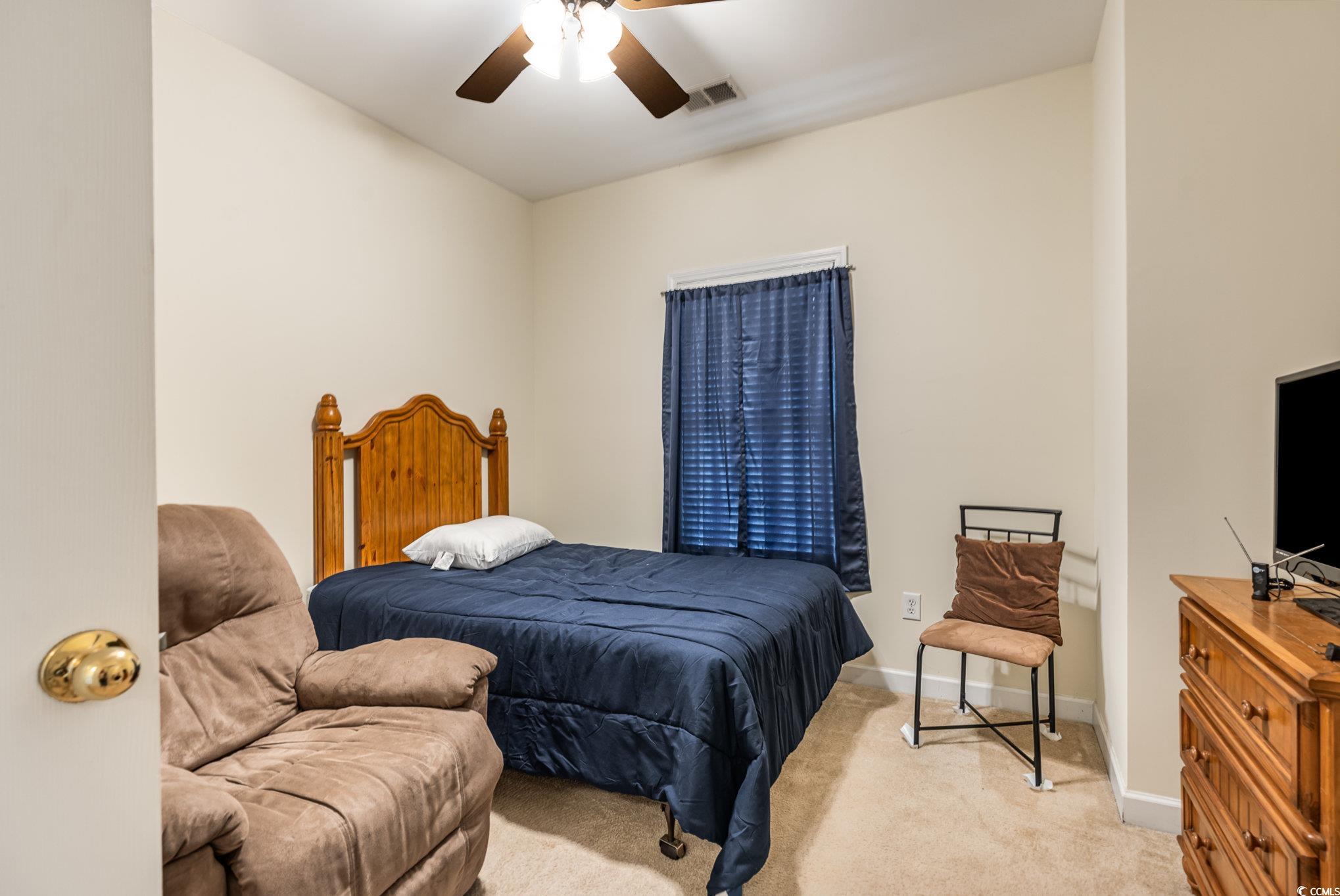 336 Kiskadee Loop, Unit A Conway, SC 29526 - Photo 22 of 27 Carpeted bedroom featuring ceiling fan