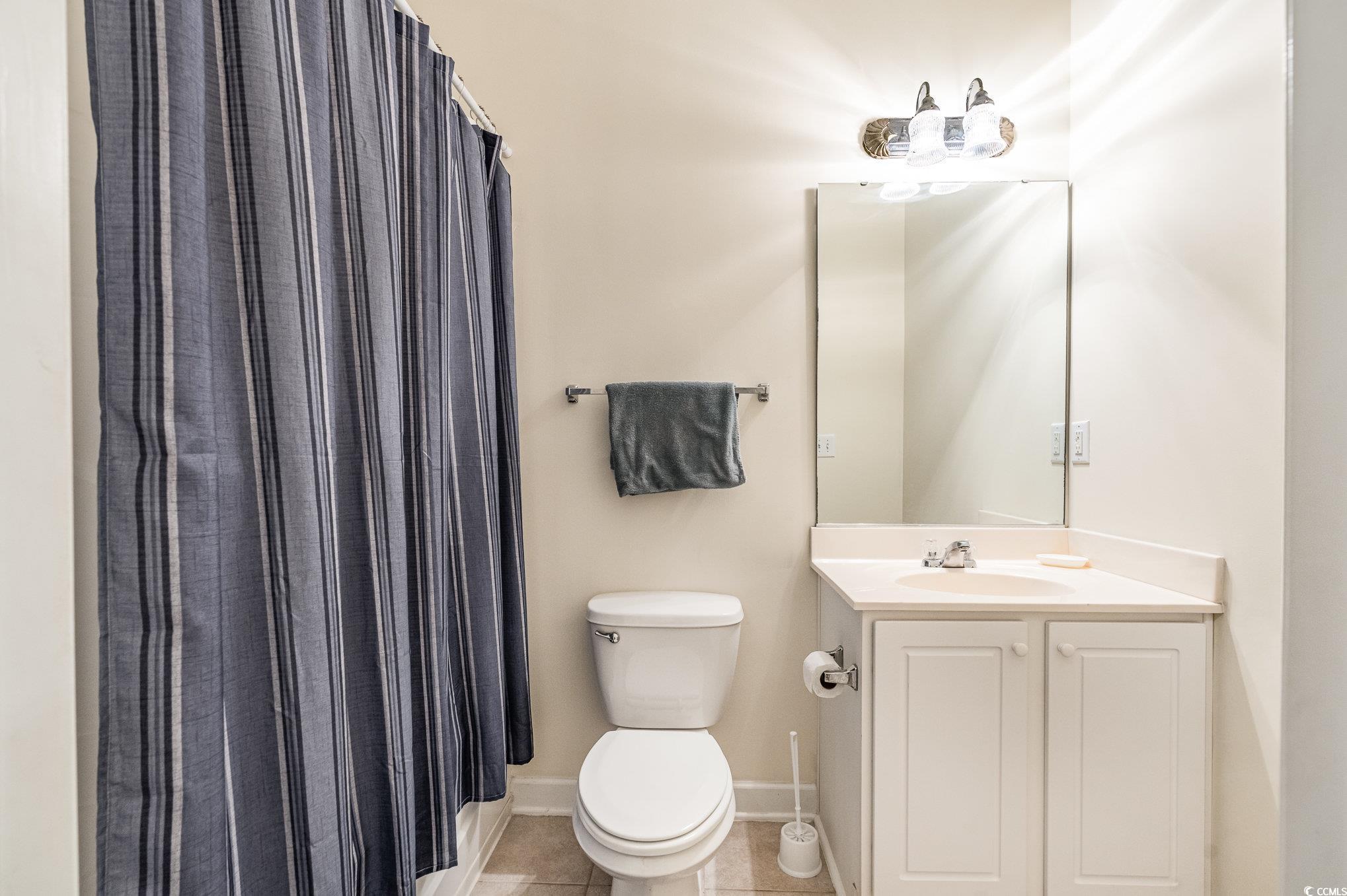 336 Kiskadee Loop, Unit A Conway, SC 29526 - Photo 23 of 27 Bathroom with tile patterned floors, toilet, vanit