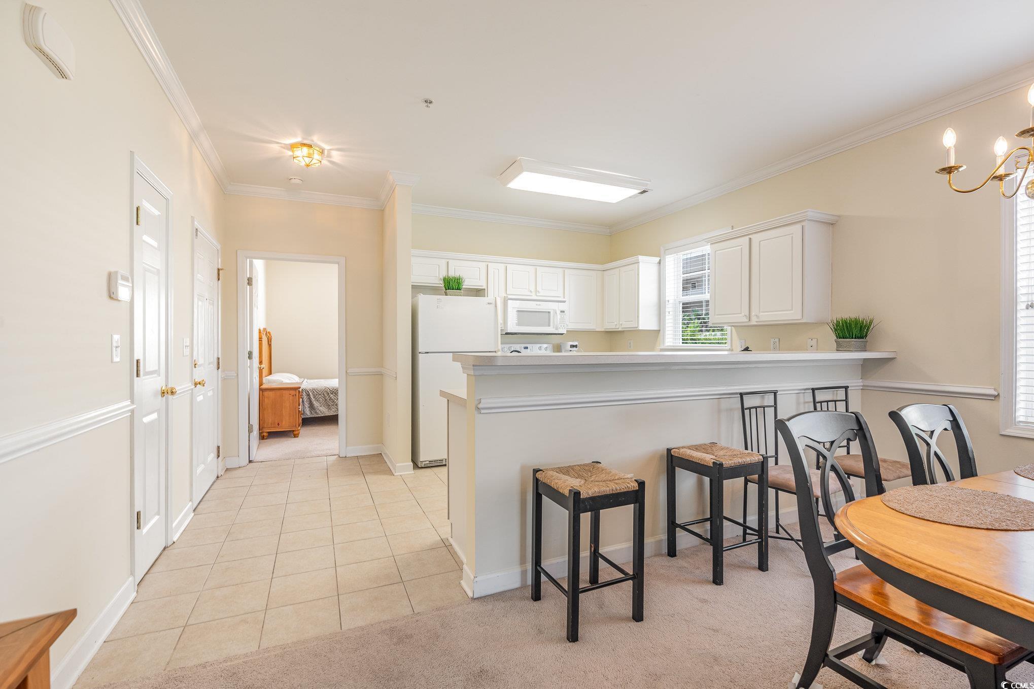 336 Kiskadee Loop, Unit A Conway, SC 29526 - Photo 5 of 27 Kitchen featuring kitchen peninsula, white applian