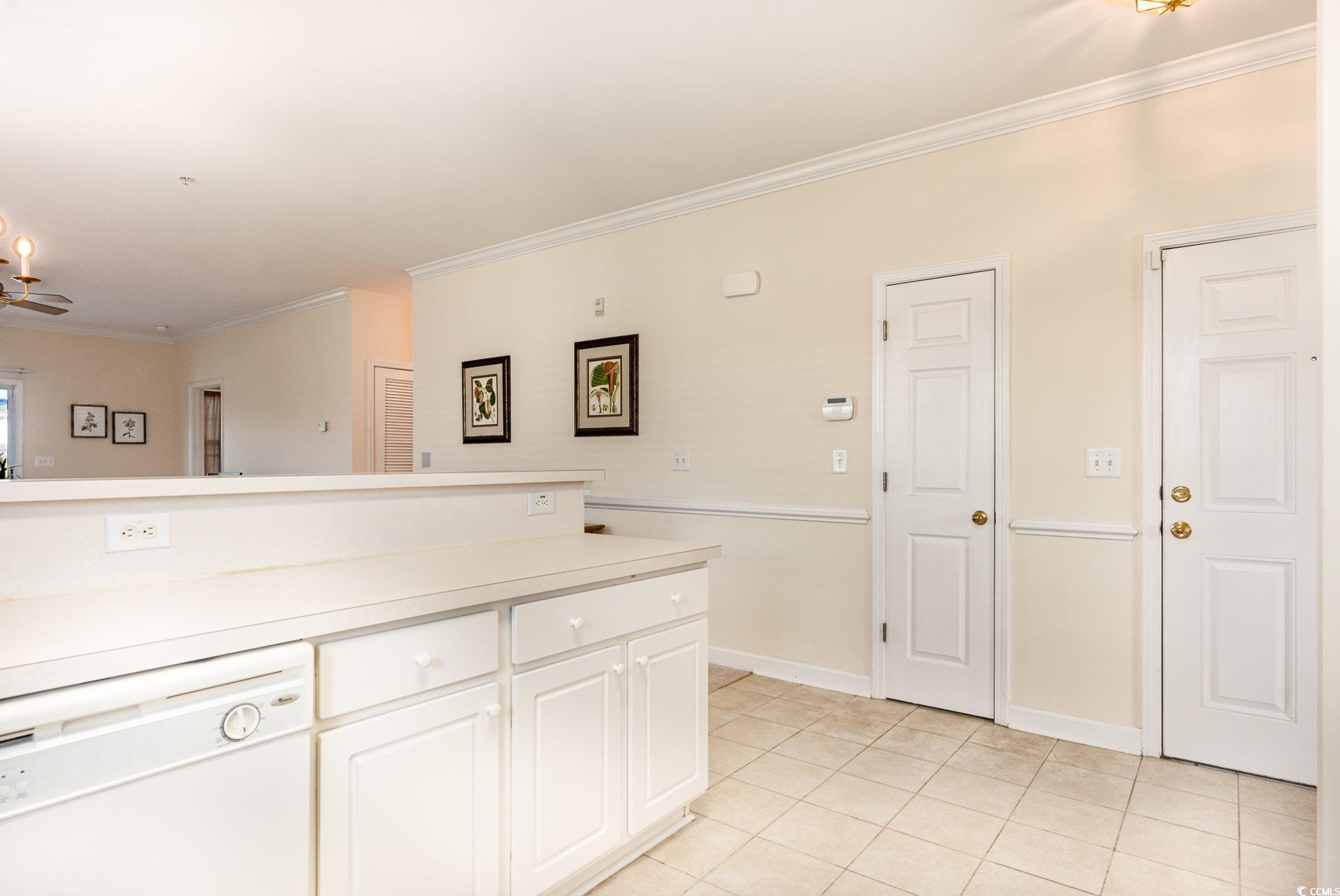 336 Kiskadee Loop, Unit A Conway, SC 29526 - Photo 8 of 27 Kitchen featuring ornamental molding, white cabine