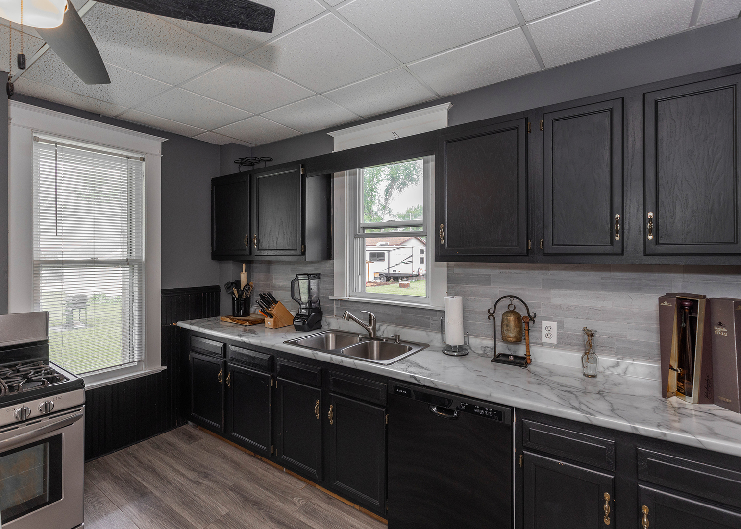 1839 15th Street Moline, IL 61265 - Photo 19 of 32 a kitchen with sink a microwave and cabinets
